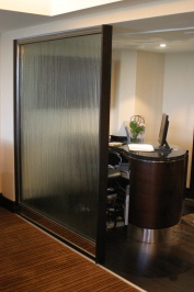 SG20 fire rated partition in mirror polished stainless steel with toughened glazing. Other options are available